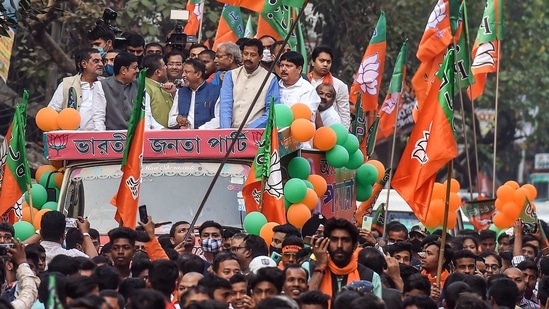 Kolkata: BJP leaders Suvendu Adhikary, Mukul Roy, Rajeev Banerjee and others during a roadshow for upcoming polls, in Kolkata, Wednesday, Feb 24, 2021. (PTI Photo/Swapan Mahapatra)(PTI02_24_2021_000151B)(PTI) Kolkata: BJP leaders Suvendu Adhikary, Mukul Roy, Rajeev Banerjee and others during a roadshow for upcoming polls, in Kolkata, Wednesday, Feb 24, 2021. (PTI Photo/Swapan Mahapatra)(PTI02_24_2021_000151B)(PTI)