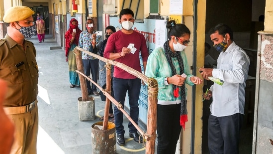 Thermal guns are being used to measure temperature of each voter and masks and sanitiser bottles being provided at polling stations, an official said.(PTI) Thermal guns are being used to measure temperature of each voter and masks and sanitiser bottles being provided at polling stations, an official said.(PTI)
