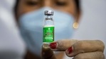 A health worker shows vaccine before administering.(AP) A health worker shows vaccine before administering.(AP)
