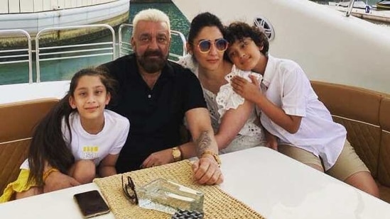 Sanjay Dutt poses with his family on a yacht.