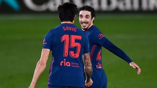 Atletico Madrid's Sime Vrsaljko and Stefan Savic celebrate their first goal, an own goal scored by Villarreal's Alfonso Pedraza.(REUTERS)