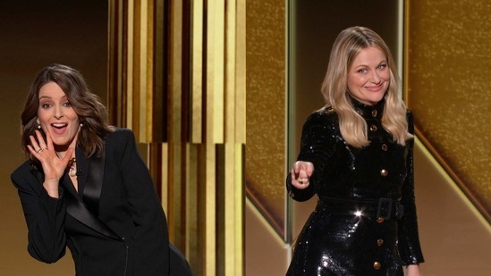 Hosts Tina Fey (L), from New York, and Amy Poehler, from Beverly Hills, speaking at the Golden Globe ceremony, on February 28. The 78th annual Golden Globe Awards ceremony took place from both coasts of the US this year --Rainbow Room in New York and Beverly Hilton in Los Angeles.(NBC via AP)