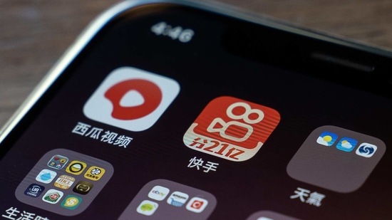 Icons for ByteDance Ltd.'s Xigua Video app, top left, and the Kuaishou Technology app, top second left, on a smartphone in Hong Kong, China. (Bloomberg)