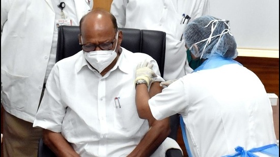 NCP leader Sharad Pawar being administered his first dose of Covid-19 vaccine at Sir JJ Hospital in Mumbai on Monday. (HT Photo)