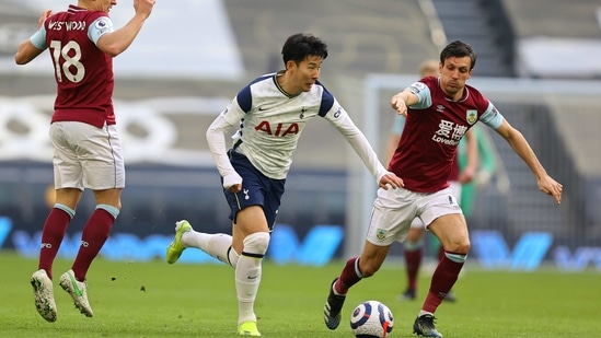 Tottenham's Son Heung-min, centre, runs with the ball during an English Premier League match.(AP)