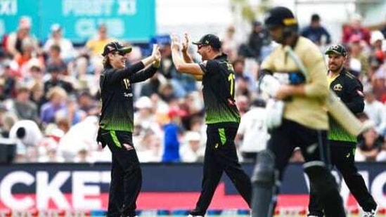 Australia's Adam Zampa left, celebrates with teammate Marcus Stoinis after taking a catch to dismiss New Zealand's Devon Conway during the second T20 cricket international between Australia and New Zealand at University Oval In Dunedin.(AP) Australia's Adam Zampa left, celebrates with teammate Marcus Stoinis after taking a catch to dismiss New Zealand's Devon Conway during the second T20 cricket international between Australia and New Zealand at University Oval In Dunedin.(AP)