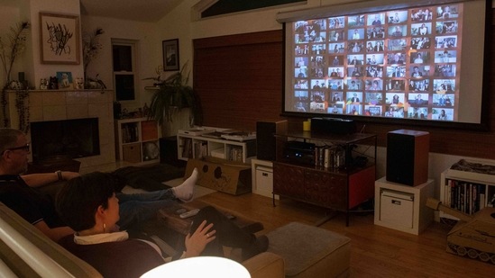 A couple watches the Golden Globe Awards from the comfort of their home in Eagle Rock, California. The Hollywood Foreign Press Association (HFPA), the body that conducts the Golden Globes which is facing fire over its lack of Black representation among its ranks, tried to douse the flames as it awarded people of colour in top acting categories.(Valerie Macon / AFP)
