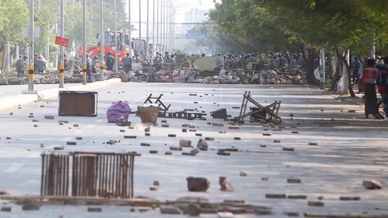 Myanmar riot police clear the barricade to move forward during a protest against the military coup in Mandalay, Myanmar. (AP Photo) Myanmar riot police clear the barricade to move forward during a protest against the military coup in Mandalay, Myanmar. (AP Photo)