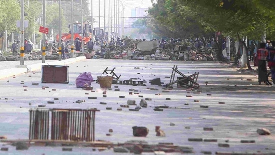 Myanmar riot police clear the barricade to move forward during a protest against the military coup in Mandalay, Myanmar.(AP Photo) Myanmar riot police clear the barricade to move forward during a protest against the military coup in Mandalay, Myanmar.(AP Photo)