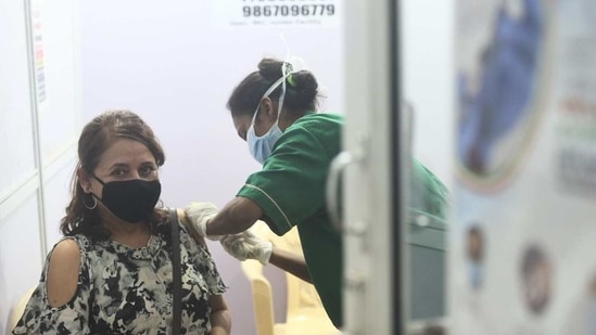 Mumbaikars queued up at Bandra-Kurla Complex's Jumbo Covid-19 hospital to receive their Covid-19 shots. Satish Bate/HT(Satish Bate) Mumbaikars queued up at Bandra-Kurla Complex's Jumbo Covid-19 hospital to receive their Covid-19 shots. Satish Bate/HT(Satish Bate)