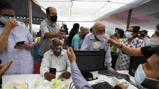 According to the health ministry’s Co-WIN guidelines issued on Sunday, one person will be able to register only three more eligible people using their mobile number.(Photo by Satish Bate/HT) According to the health ministry’s Co-WIN guidelines issued on Sunday, one person will be able to register only three more eligible people using their mobile number.(Photo by Satish Bate/HT)
