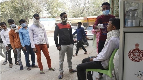 People giving swab samples at Civil Hospital as testing for Covid-19 increases due to a spike in cases around NCR, in Gurugram, India on February 28, 2021. (HT PHOTO) People giving swab samples at Civil Hospital as testing for Covid-19 increases due to a spike in cases around NCR, in Gurugram, India on February 28, 2021. (HT PHOTO)