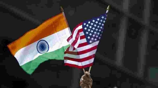 A man holds the flags of India and the US flag in New York.(REUTERS) A man holds the flags of India and the US flag in New York.(REUTERS)