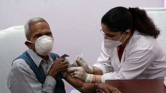 A health worker administers the Covishield vaccine to an elderly visitor at Rajiv Gandhi Super Speciality Hospital in New Delhi, India, on Monday, March 1, 2021 (Bloomberg) A health worker administers the Covishield vaccine to an elderly visitor at Rajiv Gandhi Super Speciality Hospital in New Delhi, India, on Monday, March 1, 2021 (Bloomberg)