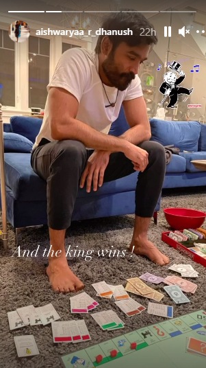 Dhanush engrossed with a game of monopoly.