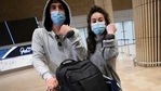 Israeli travellers hold up electronic monitoring bracelets they are required to wear after returning from abroad at the Ben Gurion airport near Tel Aviv, on Monday.(AP Photo) Israeli travellers hold up electronic monitoring bracelets they are required to wear after returning from abroad at the Ben Gurion airport near Tel Aviv, on Monday.(AP Photo)