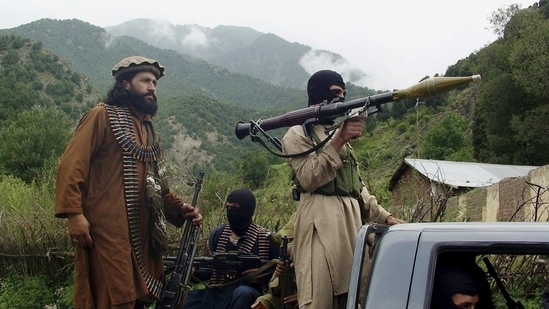 Pakistani Taliban patrol in their stronghold of Shawal in Pakistani tribal region of South Waziristan in this file photo in this file photo from 2012. (AP Photo)