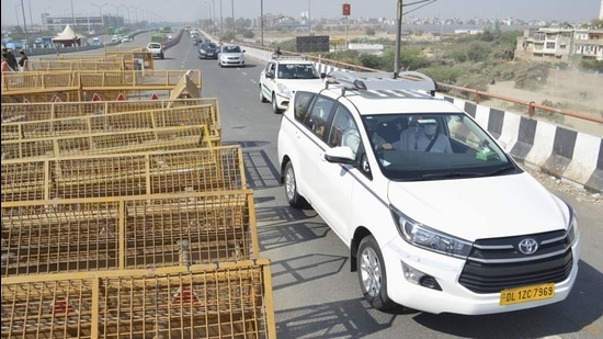 Vehicles move towards Ghaziabad after the road connecting it with Delhi via Ghazipur reopened for vehicular movement, since its closure following clashes between police and farmers on January 26 in New Delhi, Tuesday. (PTI)