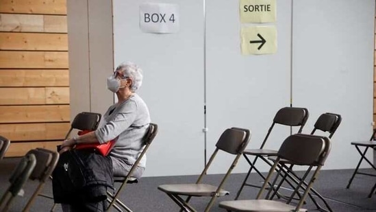 A patient waits at a coronavirus disease vaccination center installed inside a gymnasium in Taverny near Paris. (Reuters)