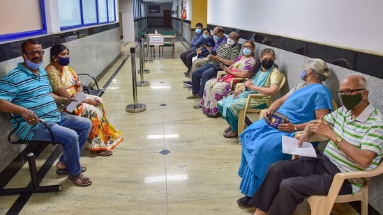 Senior citizens wait to receive the first dose of Covid-19 vaccine, during the second phase of the vaccination drive, at a private hospital in Bengaluru on March 1. On average, India has been vaccinating about 500,000 beneficiaries daily across the country, a rate that experts say is inadequate at a time when cases have begun inching up across the country.(Shailendra Bhojak / PTI)