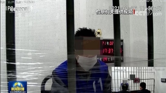 A screenshot from the video telecast by state media showing the confession of a blogger, identified as Qiu, arrested for allegedly insulting PLA soldiers online. (CCTV/SCREENGRAB)