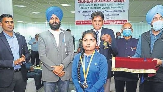 Priyanshi Thakur of Aanchal International School, Chandigarh, being honoured on Monday for winning two gold medals at the state shooting meet. Priyanshi Thakur of Aanchal International School, Chandigarh, being honoured on Monday for winning two gold medals at the state shooting meet.