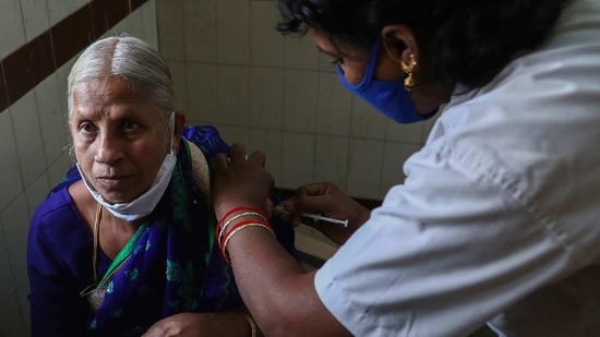 A health worker administers Covid-19 vaccine to an elderly woman at a government hospital.(Mahesh Kumar / AP) A health worker administers Covid-19 vaccine to an elderly woman at a government hospital.(Mahesh Kumar / AP)