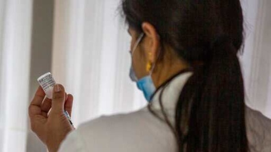 A healthcare worker prepares to administer a COVAXIN vaccine, developed by Indian company Bharat Biotech, at a private hospital in New Delhi, India, Tuesday, March 2, 2021. India is expanding its coronavirus vaccination drive beyond health care and front-line workers, offering the shots to older people and those with medical conditions that put them at risk. (AP Photo/Altaf Qadri)(AP)