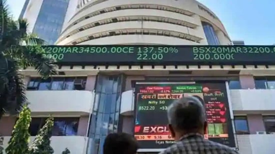 People watch the Sensex on a screen outside Bombay Stock Exchange (BSE) in Mumbai. (PTI) People watch the Sensex on a screen outside Bombay Stock Exchange (BSE) in Mumbai. (PTI)