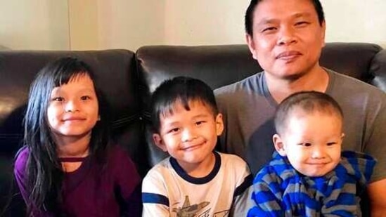 Bawi Cung, right, seated with his children at home, before he and his two sons were stabbed in an anti-Asian attack last March 2020 at Sam's Club in Midland, Texas.(AP) Bawi Cung, right, seated with his children at home, before he and his two sons were stabbed in an anti-Asian attack last March 2020 at Sam's Club in Midland, Texas.(AP)