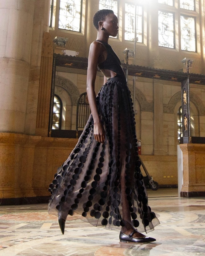 A model sports a black sheer panelled dress with cutout details on the sides (Photo: Instagram/CarolinaHerrera) A model sports a black sheer panelled dress with cutout details on the sides (Photo: Instagram/CarolinaHerrera)