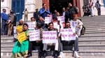 Congress MLAs stage a sit-in at the entrance of the House in Gharsain on Wednesday, March 3. Speaker Premchand Agarwal stands with folded hands) . (Kalyan Das/HT photo) Congress MLAs stage a sit-in at the entrance of the House in Gharsain on Wednesday, March 3. Speaker Premchand Agarwal stands with folded hands) . (Kalyan Das/HT photo)