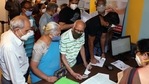 Senior citizens enquiring at the registration desk as they arrive to get the first dose of COVID-19 vaccine during the second phase of the COVID-19 vaccination in Bengaluru on Monday(ANI) Senior citizens enquiring at the registration desk as they arrive to get the first dose of COVID-19 vaccine during the second phase of the COVID-19 vaccination in Bengaluru on Monday(ANI)