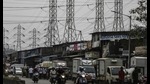 Electrical power lines hang from a transmission pylons alongside a road in Mumbai, on October 12, 2020. India’s financial capital saw its biggest power outage in decades on the day. (File photo) Electrical power lines hang from a transmission pylons alongside a road in Mumbai, on October 12, 2020. India’s financial capital saw its biggest power outage in decades on the day. (File photo)