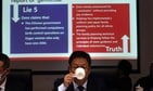 Xu Guixiang, a deputy spokesperson for the Xinjiang regional government, drinks from a cup near a slide refuting claims of genocide during a press conference in Beijing, China.(AP Photo) Xu Guixiang, a deputy spokesperson for the Xinjiang regional government, drinks from a cup near a slide refuting claims of genocide during a press conference in Beijing, China.(AP Photo)