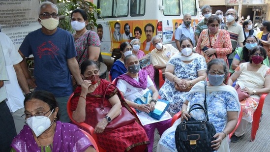 People wait during a Covid-19 vaccination drive at Kopri, in Thane on March 2. India on March 3 registered a spike in daily infections from the previous days' 12,286 cases reporting 14,989 new cases a day later, HT reported.(Praful Gangurde / HT Photo)