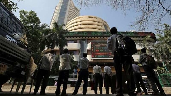 People look at a screen displaying the Sensex results on the facade of the Bombay Stock Exchange (BSE) building in Mumbai. (REUTERS) People look at a screen displaying the Sensex results on the facade of the Bombay Stock Exchange (BSE) building in Mumbai. (REUTERS)