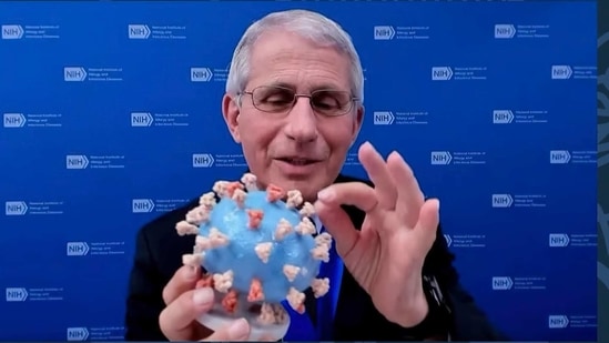 This image from video provided by Smithsonian's National Museum of American History shows Dr. Anthony Fauci holding his personal 3D model of the Covid-19 virus. (AP Photo )