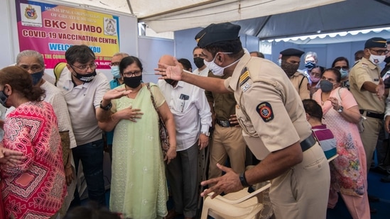 Senior citizens interact with a police personnel during a Covid-19 vaccination drive at BKC vaccination centre in Mumbai on March 2. Maharashtra leads all the states with a weekly positivity rate of 10.02%, HT reported citing Union Health Ministry data.(Pratik Chorge / HT Photo)