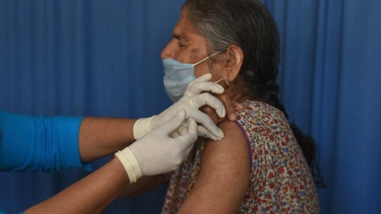 A senior citizen is inoculated against Covid-19 at a Government PolyClinic in Sector 31, Gurugram on March 2. Vaccination is gaining pace in India as the second phase of the drive is now open to senior citizens and those with co-morbidities between the age group of 45 to 59.(Vipin Kumar / HT Photo)