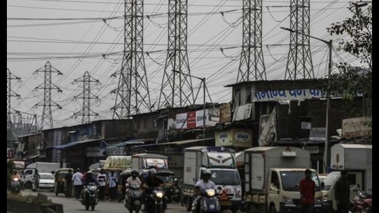 Electrical power lines hang from a transmission pylons alongside a road in Mumbai, on October 12, 2020. India’s financial capital saw its biggest power outage in decades on the day. (File photo) Electrical power lines hang from a transmission pylons alongside a road in Mumbai, on October 12, 2020. India’s financial capital saw its biggest power outage in decades on the day. (File photo)