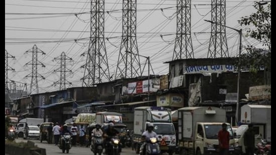 Electrical power lines hang from a transmission pylons alongside a road in Mumbai, on October 12, 2020. India’s financial capital saw its biggest power outage in decades on the day. (File photo) Electrical power lines hang from a transmission pylons alongside a road in Mumbai, on October 12, 2020. India’s financial capital saw its biggest power outage in decades on the day. (File photo)