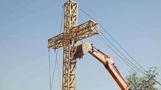 The district administration said the cross was being hoisted on a different hillock where a Christian temple existed.(HT Photo)