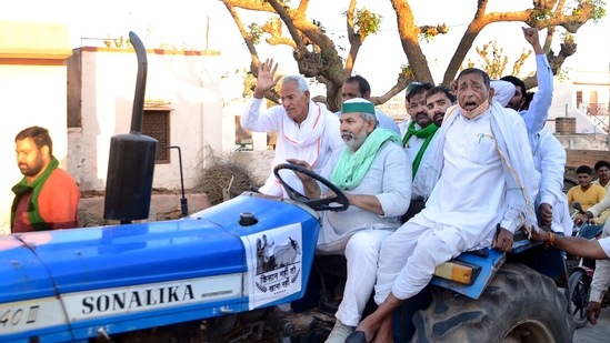 Bharatiya Kisan Union leader Rakesh Tikait (man at the wheel). (PTI Photo) Bharatiya Kisan Union leader Rakesh Tikait (man at the wheel). (PTI Photo)