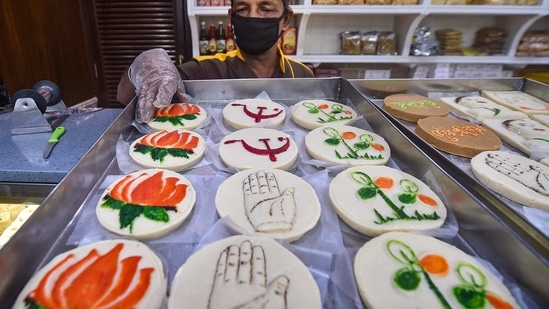 Kolkata: A vendor displays sweets with different political party symbols at his sweet shop, ahead of the State Assembly elections, in Kolkata, Wednesday, March 3, 2021. (PTI Photo/Swapan Mahapatra)(PTI03_03_2021_000049B)(PTI) Kolkata: A vendor displays sweets with different political party symbols at his sweet shop, ahead of the State Assembly elections, in Kolkata, Wednesday, March 3, 2021. (PTI Photo/Swapan Mahapatra)(PTI03_03_2021_000049B)(PTI)