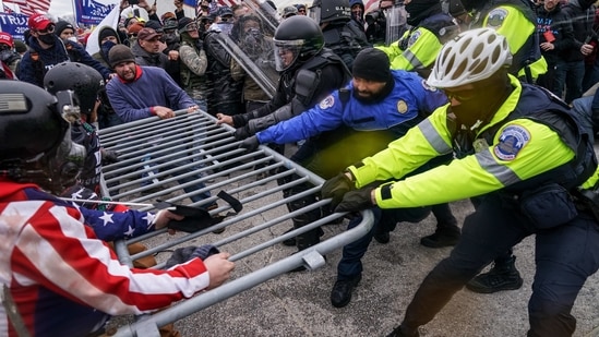 Rioters try to break through a police barrier at the Capitol in Washington on January 6.(AP / File Photo) Rioters try to break through a police barrier at the Capitol in Washington on January 6.(AP / File Photo)