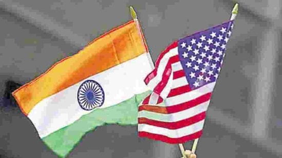 A man holds the flags of India and the US. (REUTERS) A man holds the flags of India and the US. (REUTERS)