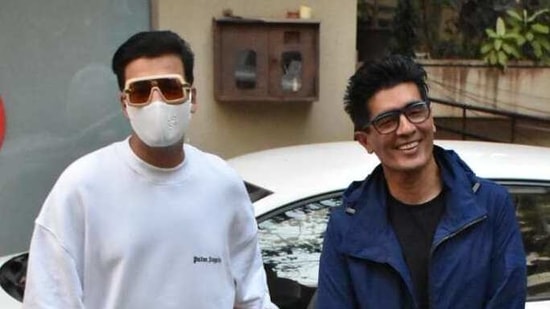 Karan Johar and Manish Malhotra arrived together at Kareena Kapoor's house and posed for the cameras.(Varinder Chawla) Karan Johar and Manish Malhotra arrived together at Kareena Kapoor's house and posed for the cameras.(Varinder Chawla)