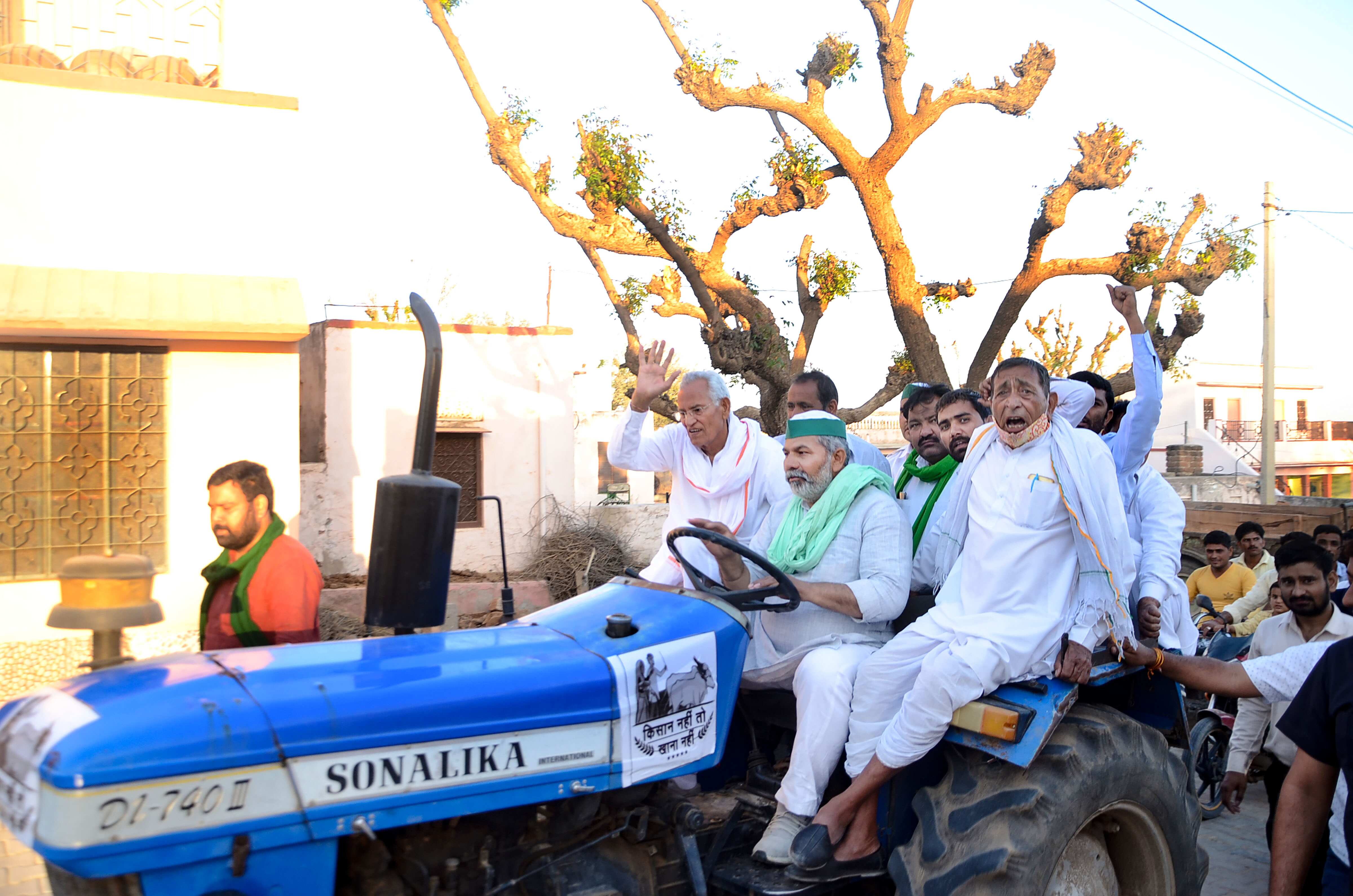 Bharatiya Kisan Union leader Rakesh Tikait (man at the wheel). (PTI Photo)