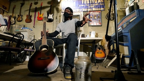 Bluesman Jimmy "Duck" Holmes gestures as he speaks of the area musicians he learned the style of the Bentonia Blues from at his Blue Front Cafe in Bentonia, Miss., Jan. 21, 2021. Holmes' ninth album, "Cypress Grove," has earned a Grammy nomination for the Best Traditional Blues Album.(AP) Bluesman Jimmy "Duck" Holmes gestures as he speaks of the area musicians he learned the style of the Bentonia Blues from at his Blue Front Cafe in Bentonia, Miss., Jan. 21, 2021. Holmes' ninth album, "Cypress Grove," has earned a Grammy nomination for the Best Traditional Blues Album.(AP)